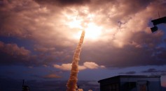 The space shuttle Columbia flies into a cloudbank which it illuminated after liftoff at the Kennedy Space Center March 1, 2002 in Cape Canaveral, FL.