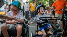 Young boys in wheelchairs participate in the first annual Disability Pride Parade on July 12, 2015 in New York City.