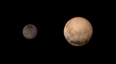 In this handout provided by the National Aeronautics and Space Administration (NASA), the dwarf planet Pluto (R) and Charon are shown July 11, 2015. 