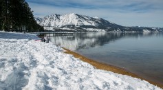 The mountains along the lake are coated in fresh snow as viewed on January 30, 2017, in South Lake Tahoe, California.