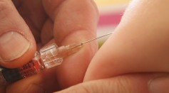 A children's doctor injects a vaccine against measles, rubella, mumps and chicken pox to an infant on February 26, 2015 in Berlin, Germany.