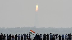 Indian onlookers watch the launch of the Indian Space Research Organisation (ISRO) Polar Satellite Launch Vehicle (PSLV-C37) at Sriharikota on Febuary 15, 2017.