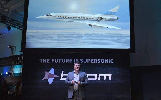 CEO and Co-founder of Boom Technologies Blake Scholl speaks before a large crowd at the XB-1 Supersonic Demonstrator official unveiling at the Boom Technologies hanger on November 15, 2016.