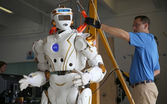 Court Edmondson works on the team NASA robot during the DARPA Robotics Challenge 