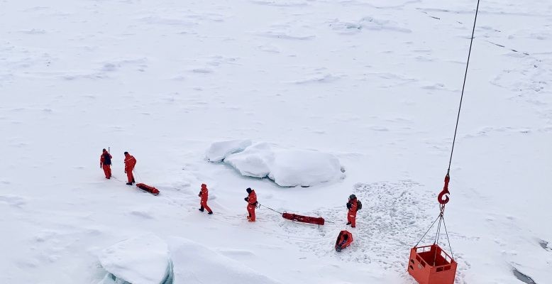 A scouting team surveys an ice floe for Polarstern