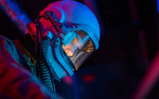 woman-in-a-spacesuit-with-blue-helmet-7672255
