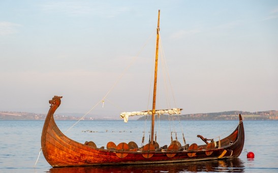 Wooden Viking boat travelling at sea