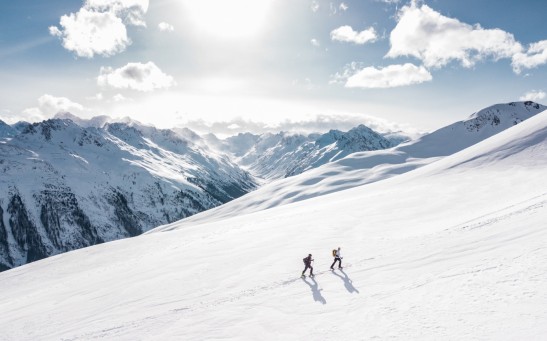 Two Men Hiking on a Snow Mountain