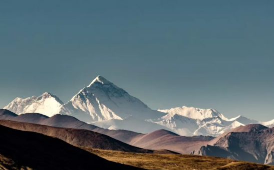 Stock image of Mount Everest as seen over the Himalayan plateau.