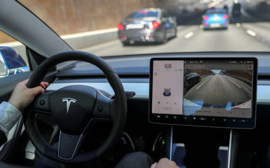 The interior of a Tesla Model 3 electric vehicle is shown in this picture illustration taken in Moscow, Russia