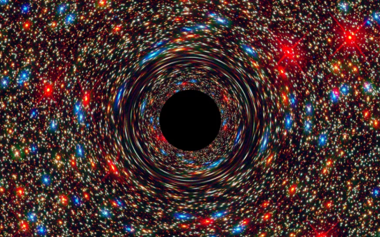 A NASA simulation shows a supermassive black hole at the center of a galaxy. Hypothetical Buchdahl stars may be like black holes in all ways, save for their inescapable pull.