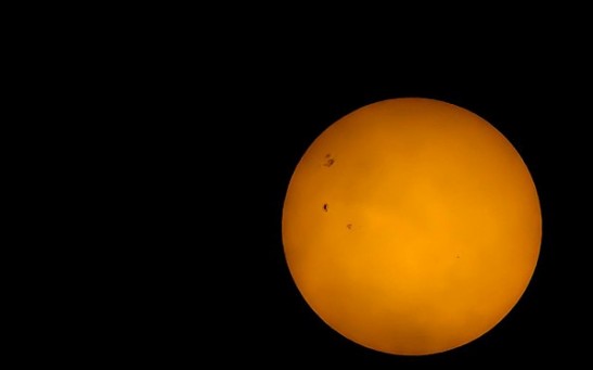 Massive Sunspot 4 Times the Earth's Size Visible to the Naked Eye