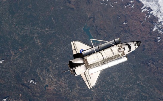 Space Shuttle Discovery Continues On Its Last Mission