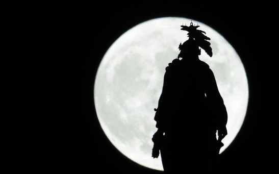 The Hunter Moon Rises Over The Autumnal Night Sky