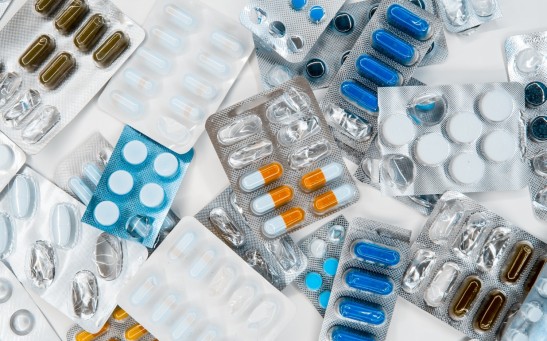 pharmaceuticals in packages of different colors, antibiotics medicine tablets, colorful antibacterial tablets lie, fighting the virus.