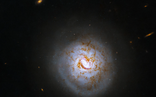 Hubble Space Telescope Captures the Cosmic Beauty of a Spiral Galaxy With an Active Black Hole