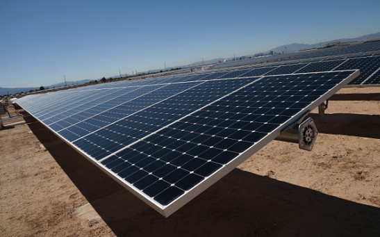 Rows of solar panels operate during a dedication ceremony to commemorate the completion of the 102-acre, 15-megawatt Solar Array II Generating Station at Nellis Air Force Base on February 16, 2016 in 