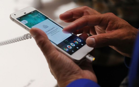 A person tries a new Google Pixel phone at the Google pop-up shop in the SoHo neighborhood on October 20, 2016 in New York City.